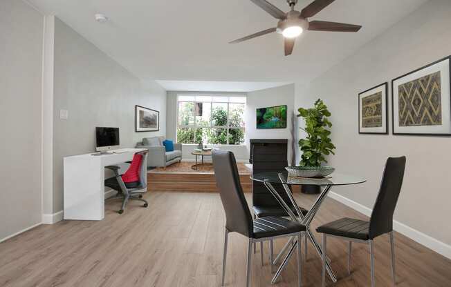 Dining area with a ceiling fan, wood style floors