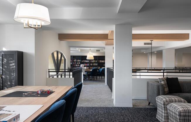a living room filled with furniture and a large window