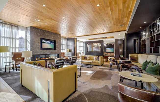 A modern living room with a fireplace and a television.