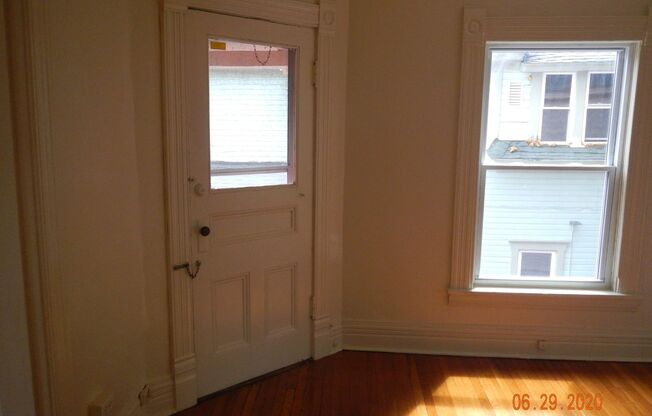 AVAILABLE 7/1/25 - Charming Second Floor Apartment One Block From Shops, Eateries and Bus lines