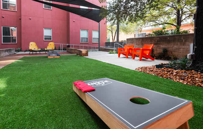 a backyard with a ping pong table and grass