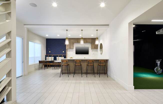 A modern kitchen with a dining table and chairs.