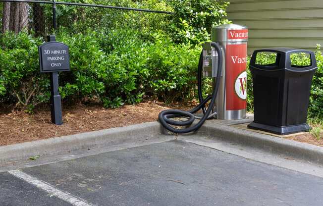 a gas station with a hose on the side of the road