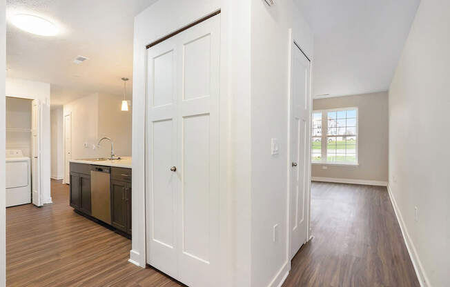 An entryway into a kitchen a hard surface flooring at Meadowbrooke Apartment Homes in Kentwood, MI 49512