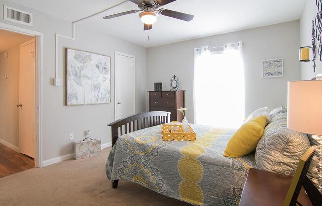 a bedroom with a bed and a couch in a living room