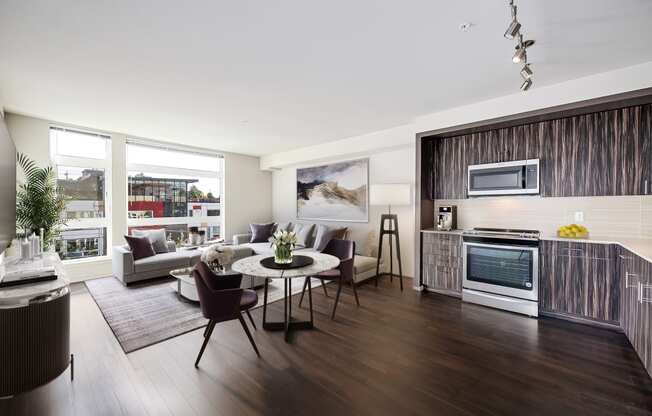 a living room with a kitchen and a table and chairs at The Hayes on Stone Way, Washington, 98103