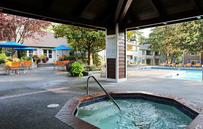 a jacuzzi and pool at the resort on a sunny day