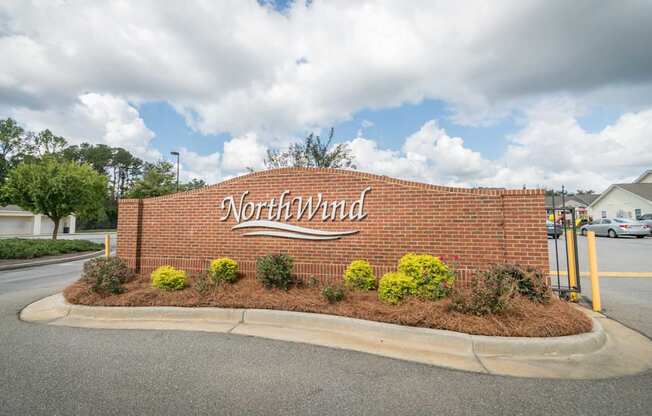 the sign at the entrance to the northeast parking lot at the northwest dealership