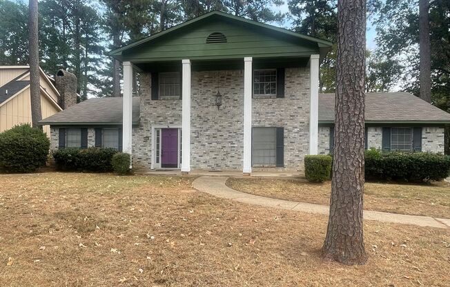 Lovely Two-Story Brick Home Located In "Western Hills" Off Pines Road