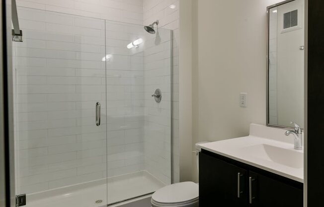 Bathroom with glass enclosed shower