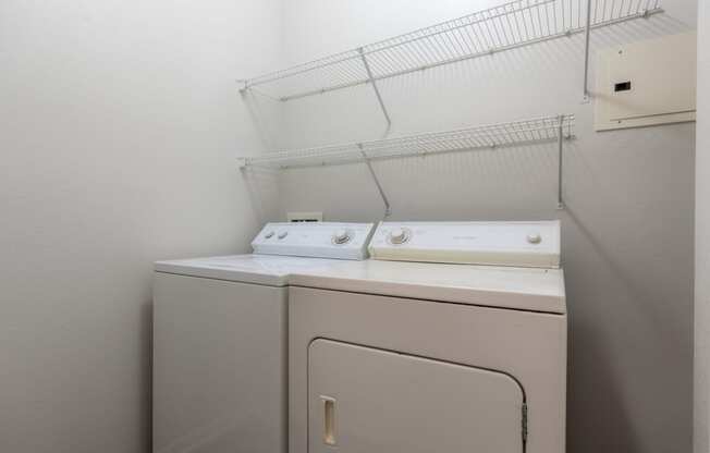 Washer and dryer at Wynnewood Farms Apartments, Overland Park, 66209