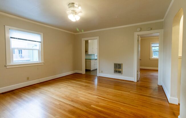 Bright One Bedroom Unit in Fourplex with Vintage Appeal, Original Hardwoods and Garage Available!