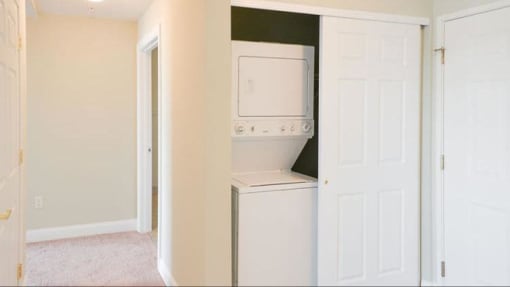 View of in-unit washer & dryer (select units)
