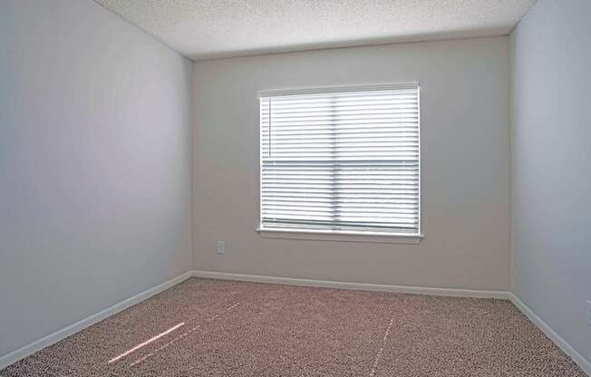 an empty room with a window in it