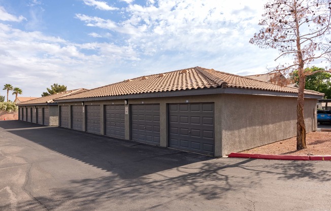 a parking lot with a row of garage doors