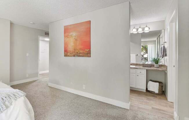 an empty bedroom with a painting on the wall at Summerwood Apartments, Santa Clara, CA 95050