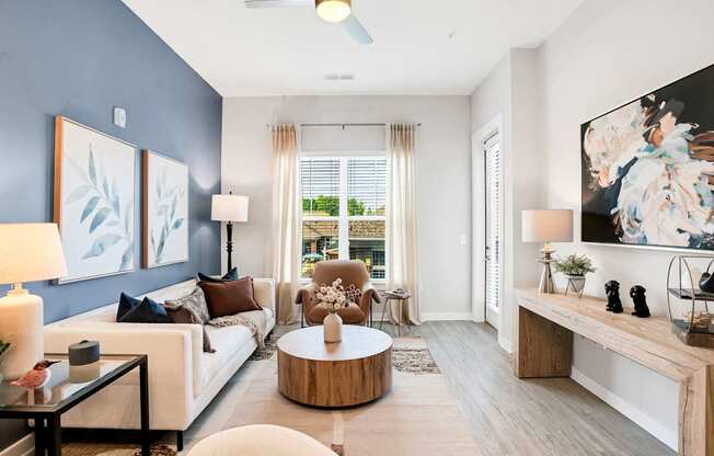 A Living Room With a White Couch at The Aster Apartments, Cary, 27519