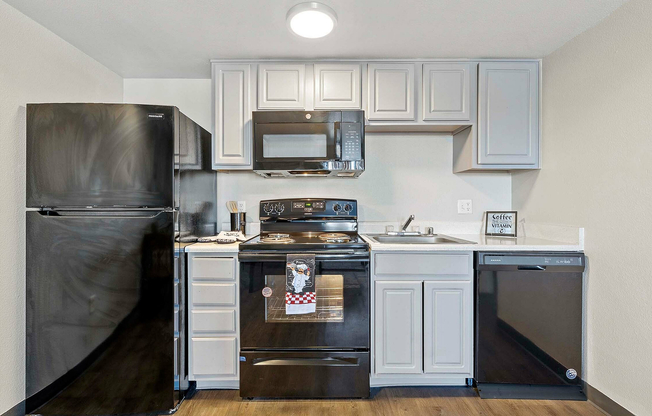 Experience contemporary cooking in this stylish kitchen equipped with essential amenities.