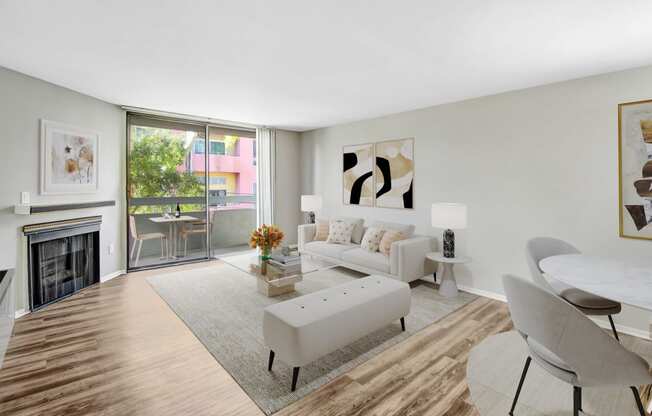 a living room with a couch and a table and a fireplace