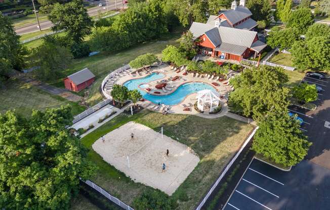 an aerial view of a swimming pool with a resort style pool