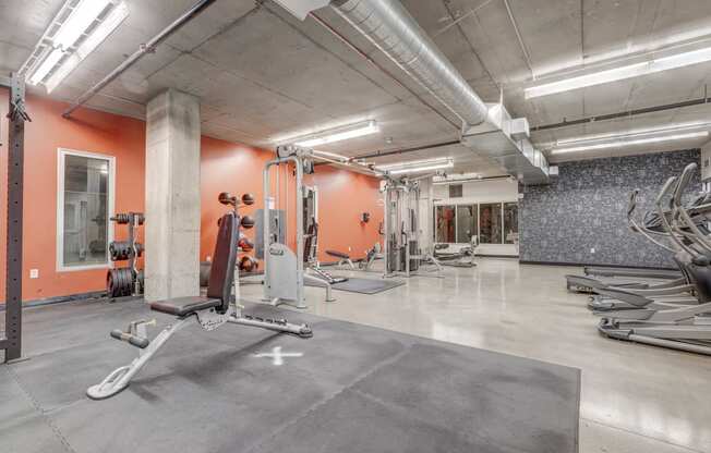 the gym at the district at highland village apartments