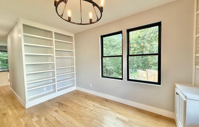 Incredible 5BD, 4.5BA Wake Forest Home Near Falls Lake with a Fully Finished Basement Living Space and a Backyard Haven Including a Large Deck, Fire Pit, and Creek