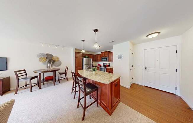 A kitchen with a dining table and chairs.
