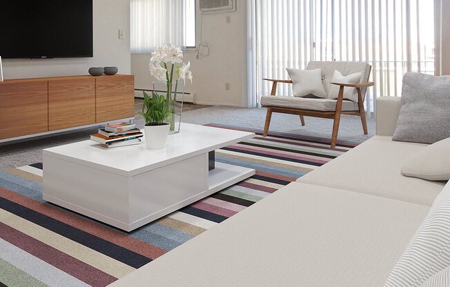 a living room with a white couch and a coffee table