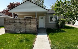 Charming 2 Bed, 1 Bath Home with Modern Updates with garage and large, fenced yard!