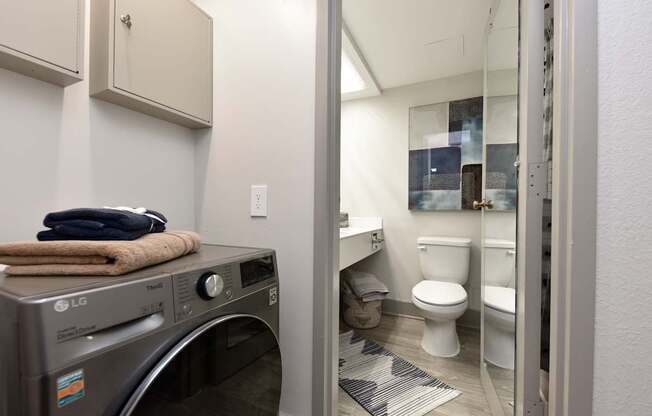 A laundry room with a washer and dryer.