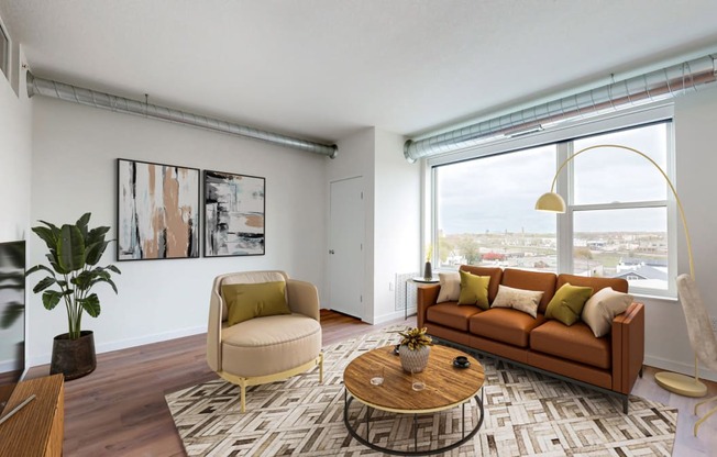 a living room with a couch and a large window