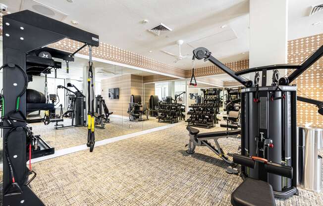 a gym with weights machines and other exercise equipment