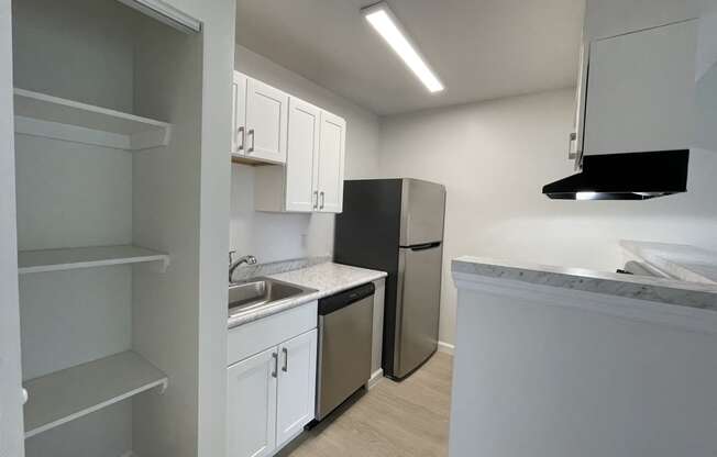 renovated kitchen with white cabinets and stainless steel appliances at Grove at St Andrews, Columbia, SC