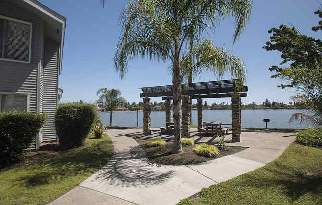 Pet Friendly Apartments in Sacramento, CA - Vue at the Lake Apartments BBQ Grilling Area Overlooking the Lake