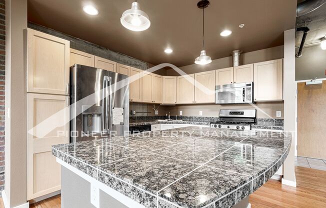 Modern Industrial Condo Downtown with Parking!