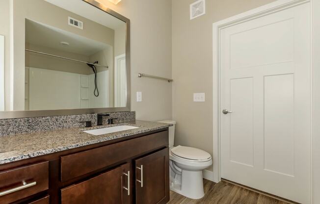 Bath with wooden floor at Level 25 at Sunset by Picerne, Nevada, 89113