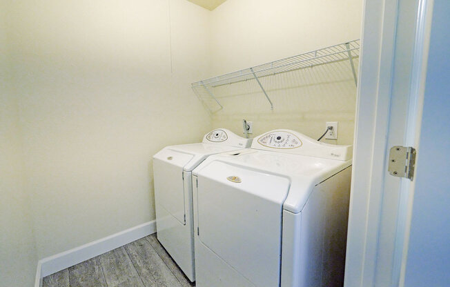 a washer and dryer in a small laundry room