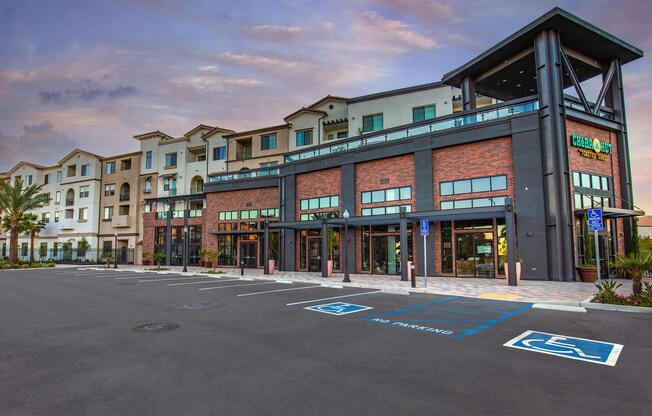 an empty parking lot in front of a building