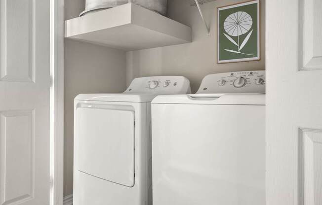A white washing machine and dryer in a laundry room.