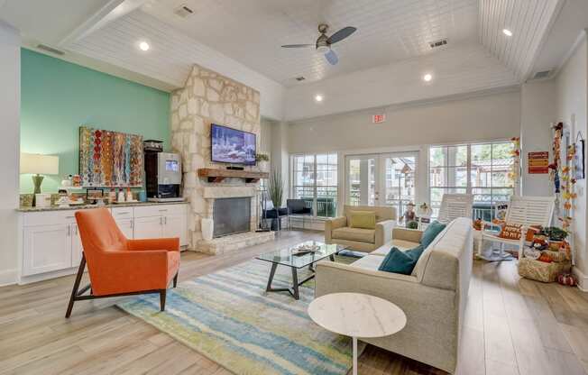 a living room with couches and chairs and a fireplace
