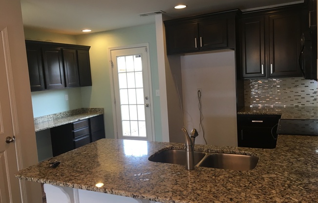 Townhome in Villages of Riverwood, Upgrades include Granite, Hdwd Floors, 1 Car Garage, Community Pool and Fitness