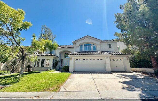 GORGEOUS 2 STORY HOME WITH A GRAND ENTRY & GOLF COURSE VIEW LOCATED INSIDE THE COMMUNITY OF RHODES RANCH