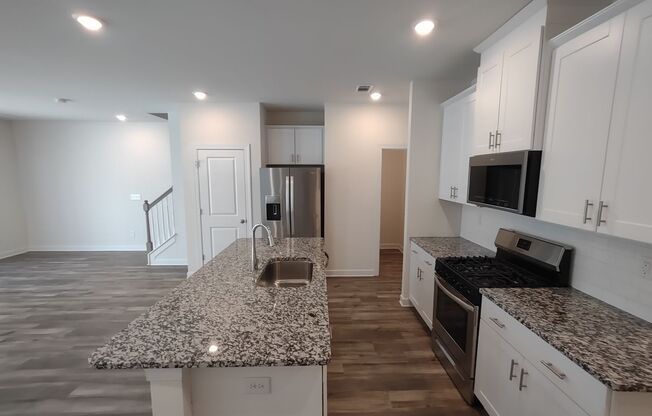Move-in ready Townhome located in Enclave at City Park!