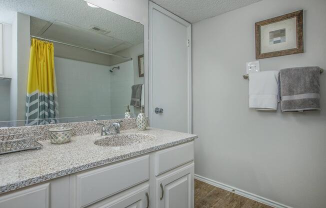 a kitchen with a sink and a mirror