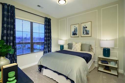 a bedroom with gray walls and a large window with blinds at Fairfax, Ohio, 43212