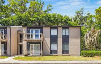 A modern two-story apartment building
with balconies and a front entrance