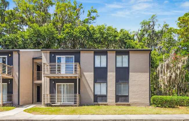 A modern two-story apartment building
with balconies and a front entrance