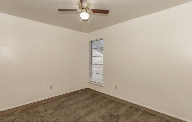 a bedroom with a large mirror