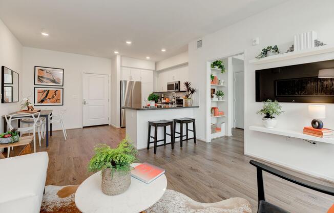 a living room filled with furniture and a flat screen tv