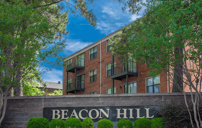 a large brick building with a sign that reads beacon hill